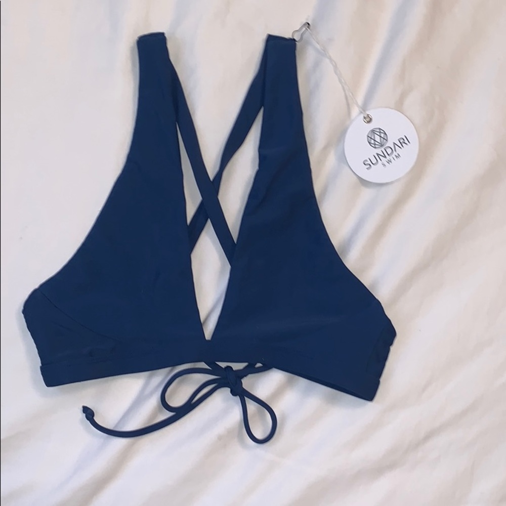 NWT!! Blue swim top size SMALL.
